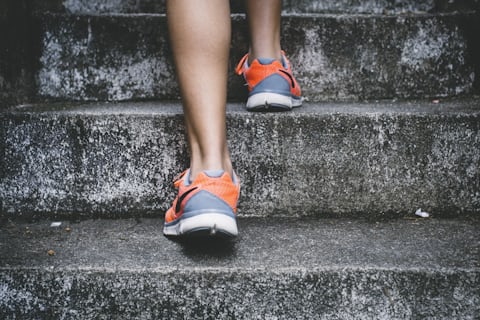 Person running on a trail